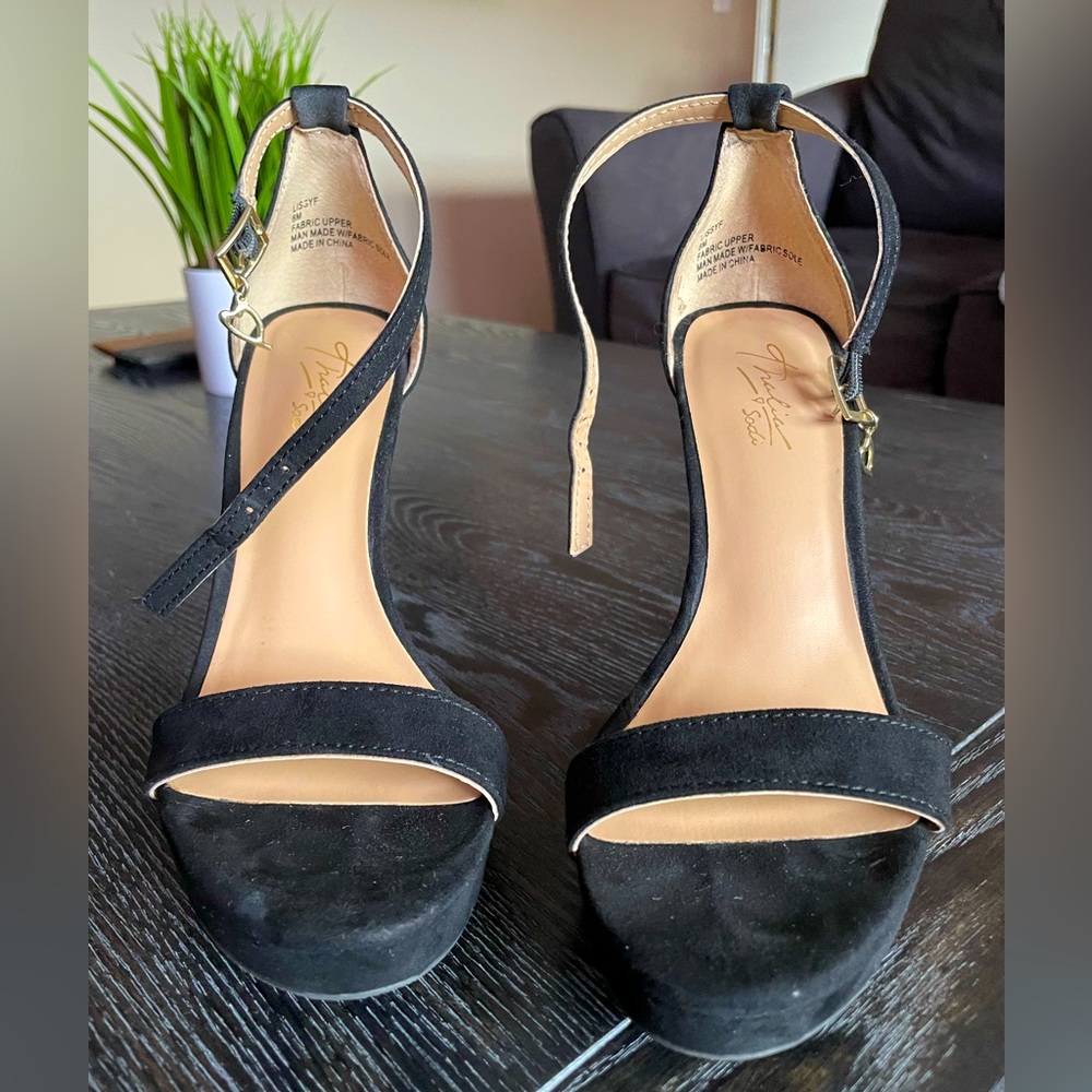 Beautiful elegant heals wore for graduation ceremony. Suede in black